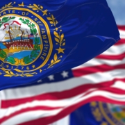 The,New,Hampshire,State,Flag,Waving,Along,With,The,National