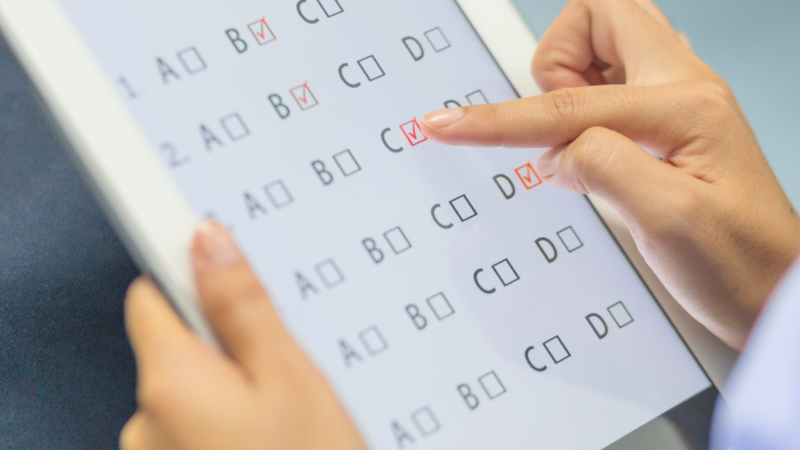 Student,Testing,Exercise,,Exams,Answer,On,Tablet,With,Multiple,Choice