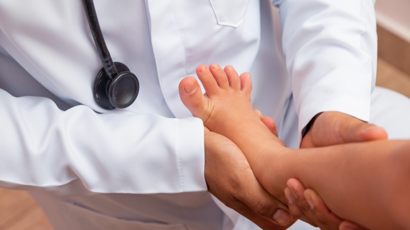 Doctor,Examining,Children’s,Feet,In,Hospital.,Surgeon,,Traumatologist,Or,Orthopedist