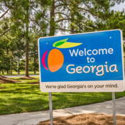 State,Sign,For,Georgia,Welcomes,Visitors,In,A,Shaded,Rest