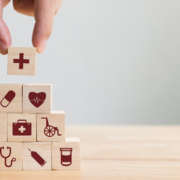 Hand,Arranging,Wood,Block,Stacking,With,Icon,Healthcare,Medical,,Insurance