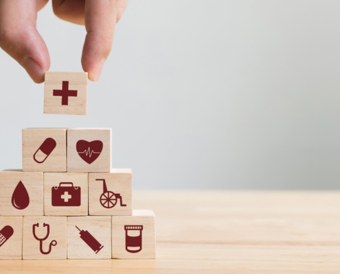 Hand,Arranging,Wood,Block,Stacking,With,Icon,Healthcare,Medical,,Insurance