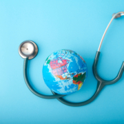 World,Health,Day,,stethoscope,Wrapped,Around,Globe,On,Pastel,Blue