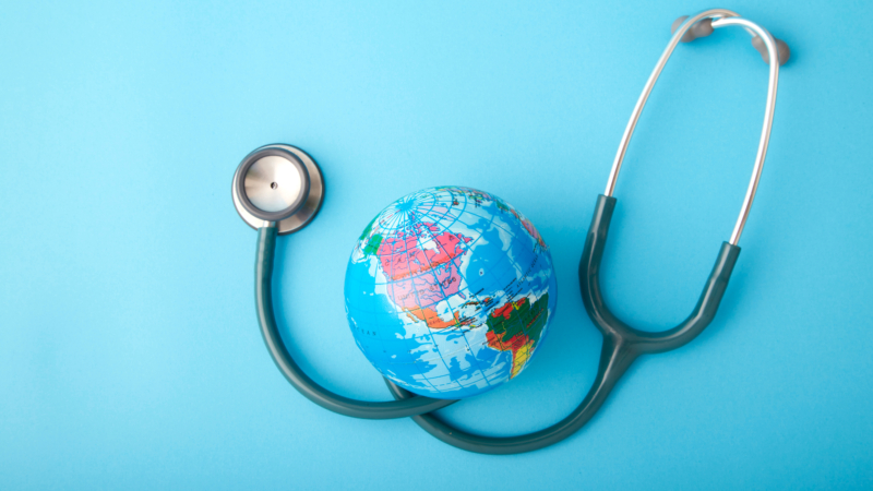World,Health,Day,,stethoscope,Wrapped,Around,Globe,On,Pastel,Blue