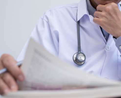 Doctor,Or,Medical,Student,Concentrate,Reading,Anatomy,Textbook,For,Medical