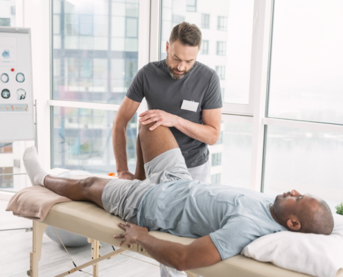 Rehabilitation,Therapy.,Professional,Male,Therapist,Working,In,The,Rehabilitation,Center