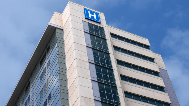 Building,With,Large,H,Sign,For,Hospital