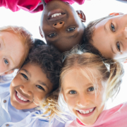 Closeup,Face,Of,Happy,Multiethnic,Children,Embracing,Each,Other,And