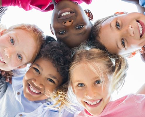 Closeup,Face,Of,Happy,Multiethnic,Children,Embracing,Each,Other,And