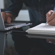 Businessman,Writing,Note,With,Pen,Inspired,Ideas,List,On,Notepad