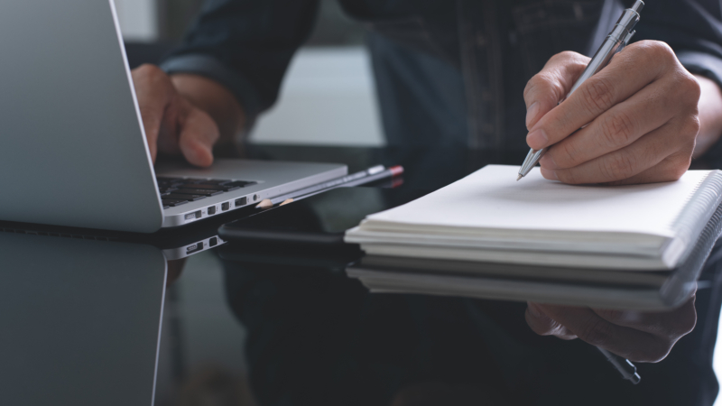 Businessman,Writing,Note,With,Pen,Inspired,Ideas,List,On,Notepad