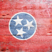 Flag,Of,Tennessee,Painted,On,Grungy,Wooden,Background