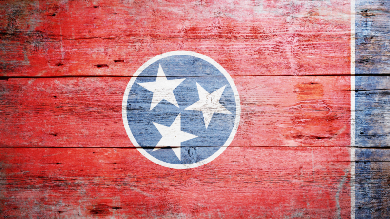 Flag,Of,Tennessee,Painted,On,Grungy,Wooden,Background