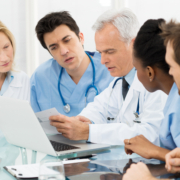 Team,Of,Expert,Doctors,Examining,Medical,Reports,At,Hospital