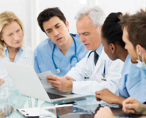 Team,Of,Expert,Doctors,Examining,Medical,Reports,At,Hospital