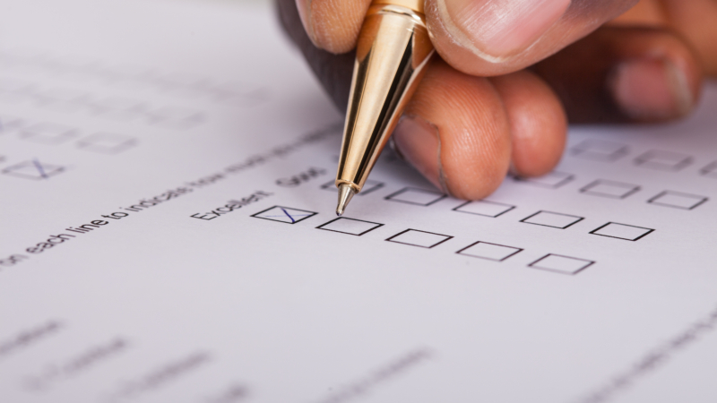 Close-up,Of,Businessman,Filling,Customer,Survey,Form