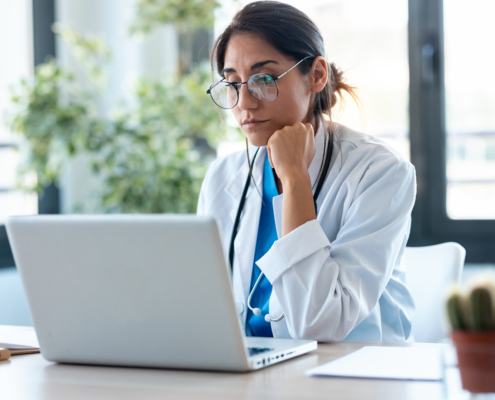 Shot,Of,Serious,Female,Doctor,Working,With,Her,Laptop,In