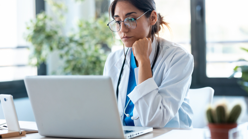 Shot,Of,Serious,Female,Doctor,Working,With,Her,Laptop,In