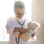 Close,Up,Pretty,Little,Girl,Playing,Doctor,,Using,Stethoscope,,Holding