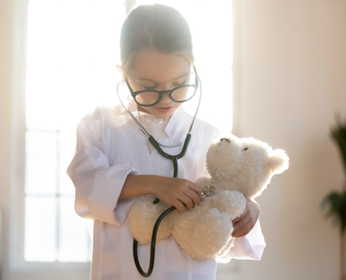 Close,Up,Pretty,Little,Girl,Playing,Doctor,,Using,Stethoscope,,Holding
