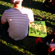 Man,With,Defund,The,Police,Sign
