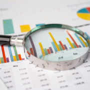 Magnifying,Glass,On,Charts,Graphs,Paper.,Financial,Development,,Banking,Account,