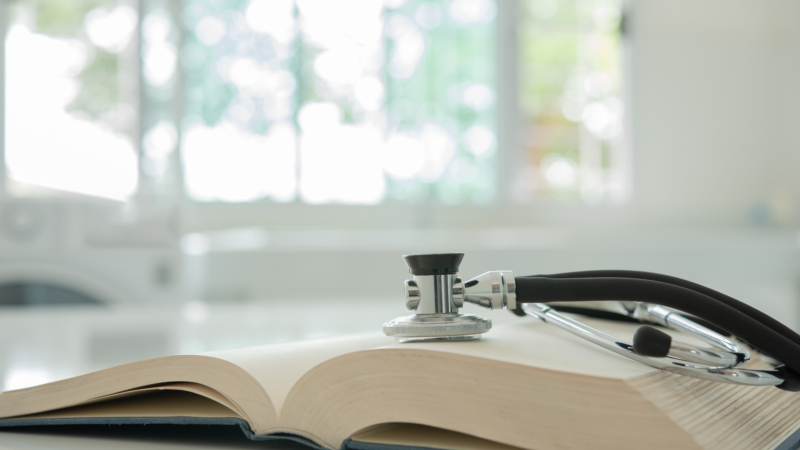 Stethoscope,On,Medical,Guide,Book,For,Doctor,Learning,Treatment,At