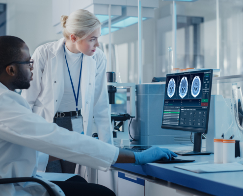 Modern,Medical,Research,Laboratory:,Two,Scientists,Use,Computer,With,Screen