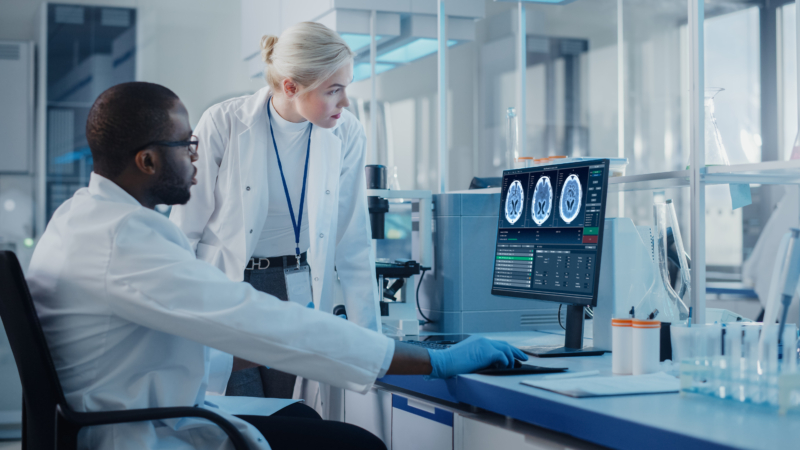 Modern,Medical,Research,Laboratory:,Two,Scientists,Use,Computer,With,Screen