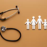 Medical,Care,Concept.,Family,Figure,With,Stethoscope,,Top,View