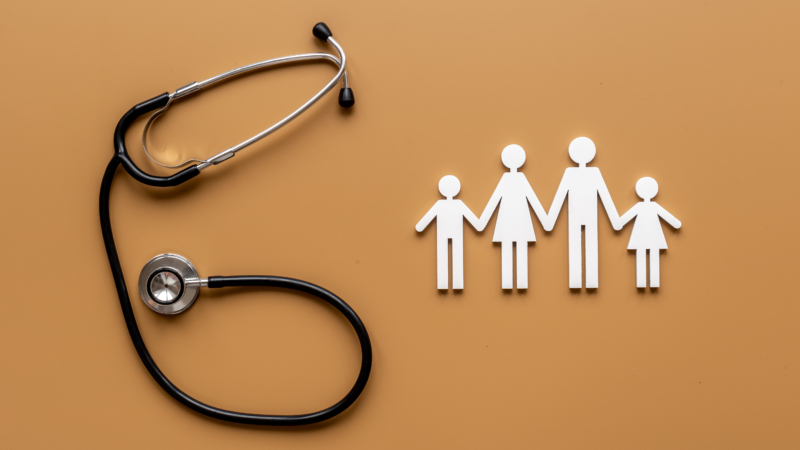 Medical,Care,Concept.,Family,Figure,With,Stethoscope,,Top,View