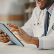 Close,Up,Of,African,American,Male,Doctor,Wearing,White,Coat