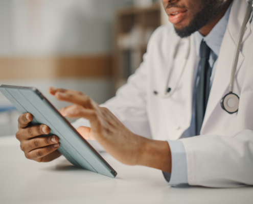 Close,Up,Of,African,American,Male,Doctor,Wearing,White,Coat