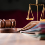 Focus,On,Hammer,,Group,Of,Files,On,Judge,Table,Covered