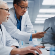 Medical,Hospital:,Neurologist,And,Neurosurgeon,Talk,,Use,Computer,,Analyse,Patient