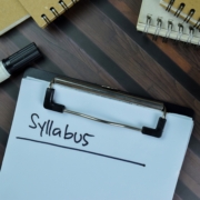 Syllabus,Write,On,A,Paperwork,Isolated,On,Wooden,Table.