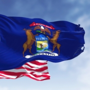 The,Michigan,State,Flag,Waving,Along,With,The,National,Flag