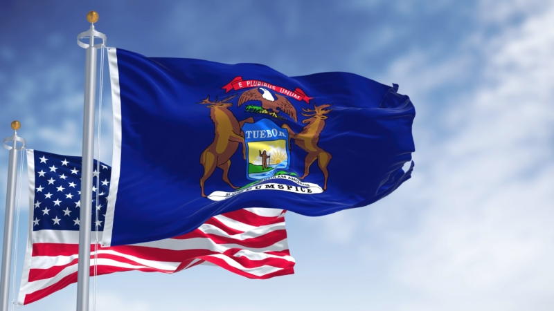The,Michigan,State,Flag,Waving,Along,With,The,National,Flag