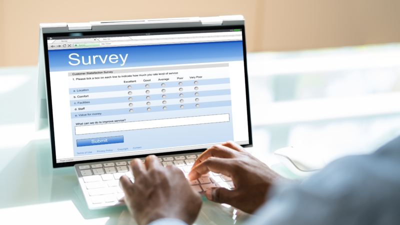 African,Man,Filling,Survey,Poll,Or,Form,On,Laptop,Computer