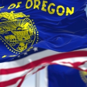 The,Oregon,State,Flag,Waving,Along,With,The,National,Flag