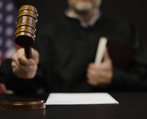 Male,Judge,Hitting,Gavel,,Calling,Court,Members,To,Stand,,United