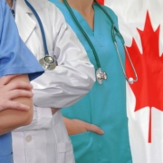 Three,Doctors,With,Stethoscope,In,Standing,On,Canada,Flag,Background.