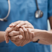 Hand,Holding,,Staff,And,Hospital,Community,With,Trust,,Support,And