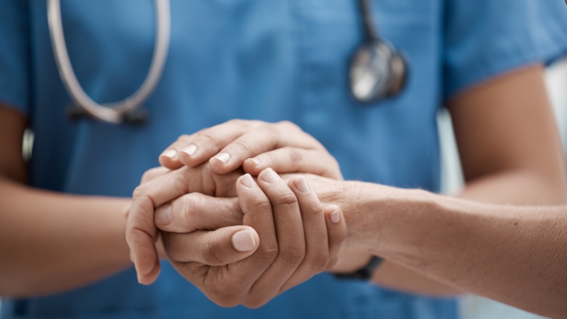 Hand,Holding,,Staff,And,Hospital,Community,With,Trust,,Support,And