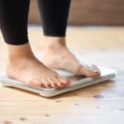 Feet,Of,An,Asian,Woman,On,A,Weight,Scale