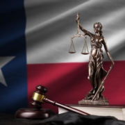 Texas,Us,State,Flag,With,Statue,Of,Lady,Justice,,Constitution