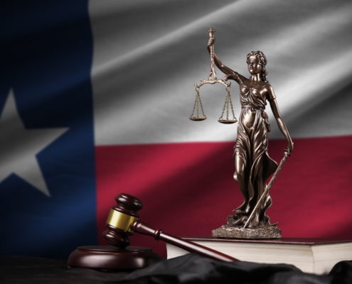 Texas,Us,State,Flag,With,Statue,Of,Lady,Justice,,Constitution