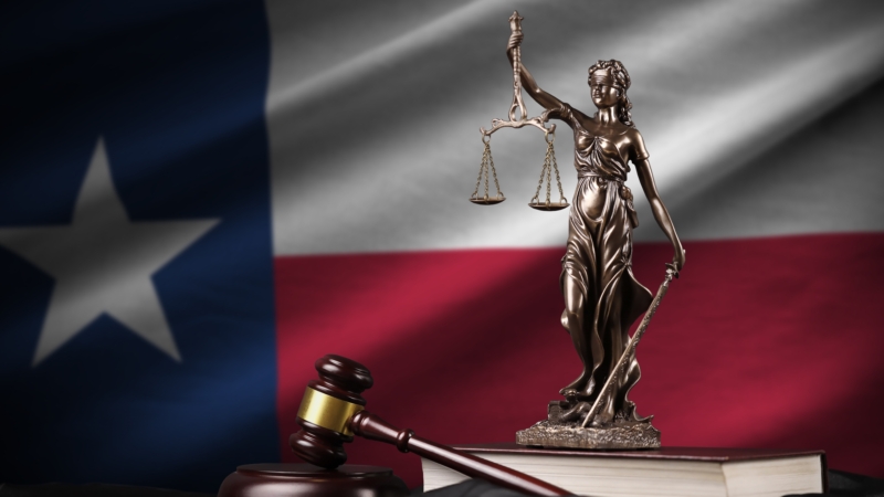 Texas,Us,State,Flag,With,Statue,Of,Lady,Justice,,Constitution