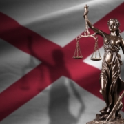 Alabama,Us,State,Flag,With,Statue,Of,Lady,Justice,And