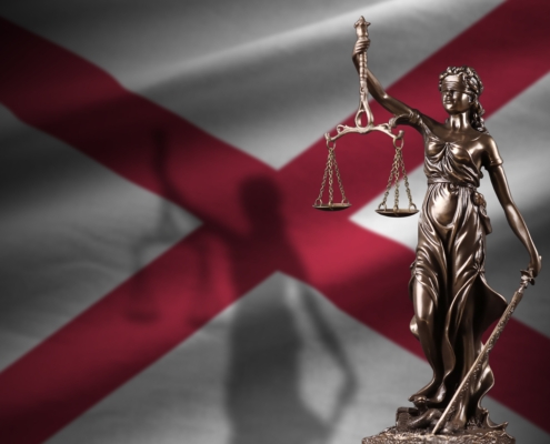Alabama,Us,State,Flag,With,Statue,Of,Lady,Justice,And